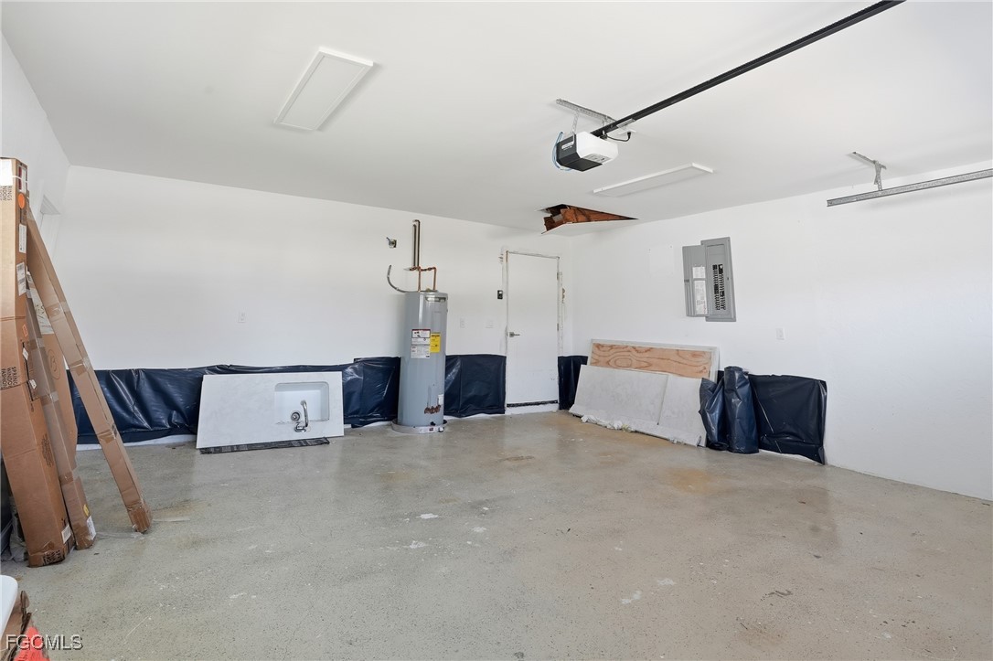 380 Conners Avenue Naples, FL 34108 - Photo 28 of 49 a bed room with a bed and a ceiling fan