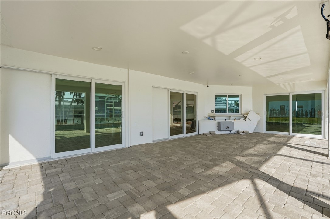 380 Conners Avenue Naples, FL 34108 - Photo 30 of 49 a view of a house with a backyard and windows
