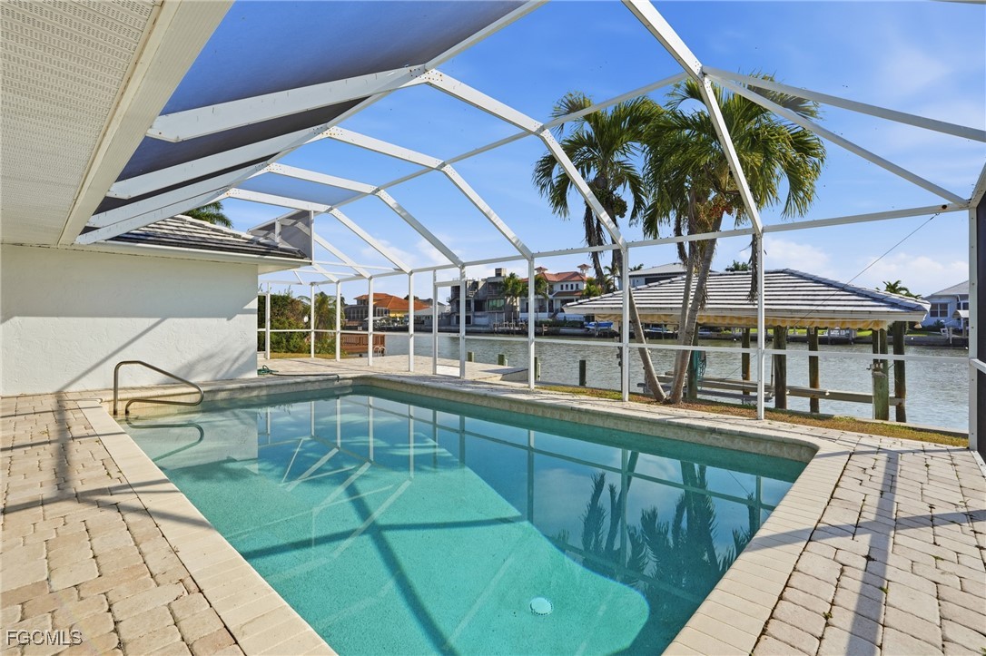 380 Conners Avenue Naples, FL 34108 - Photo 35 of 49 a view of a backyard with swimming pool