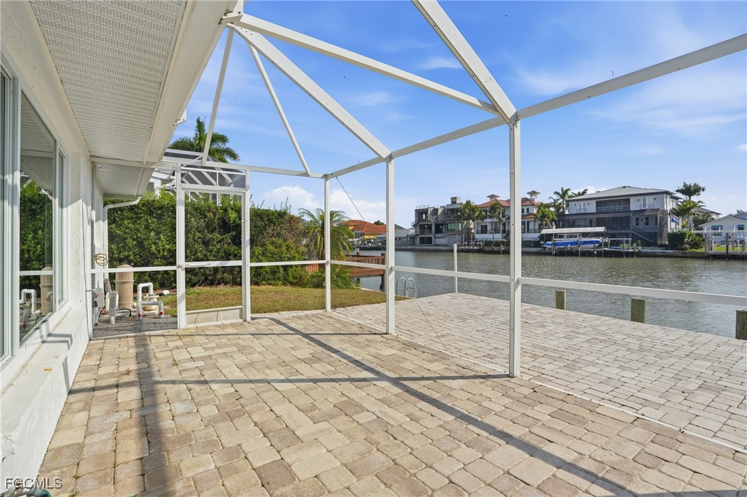 380 Conners Avenue Naples, FL 34108 - Photo 38 of 49 a view of a house with a backyard