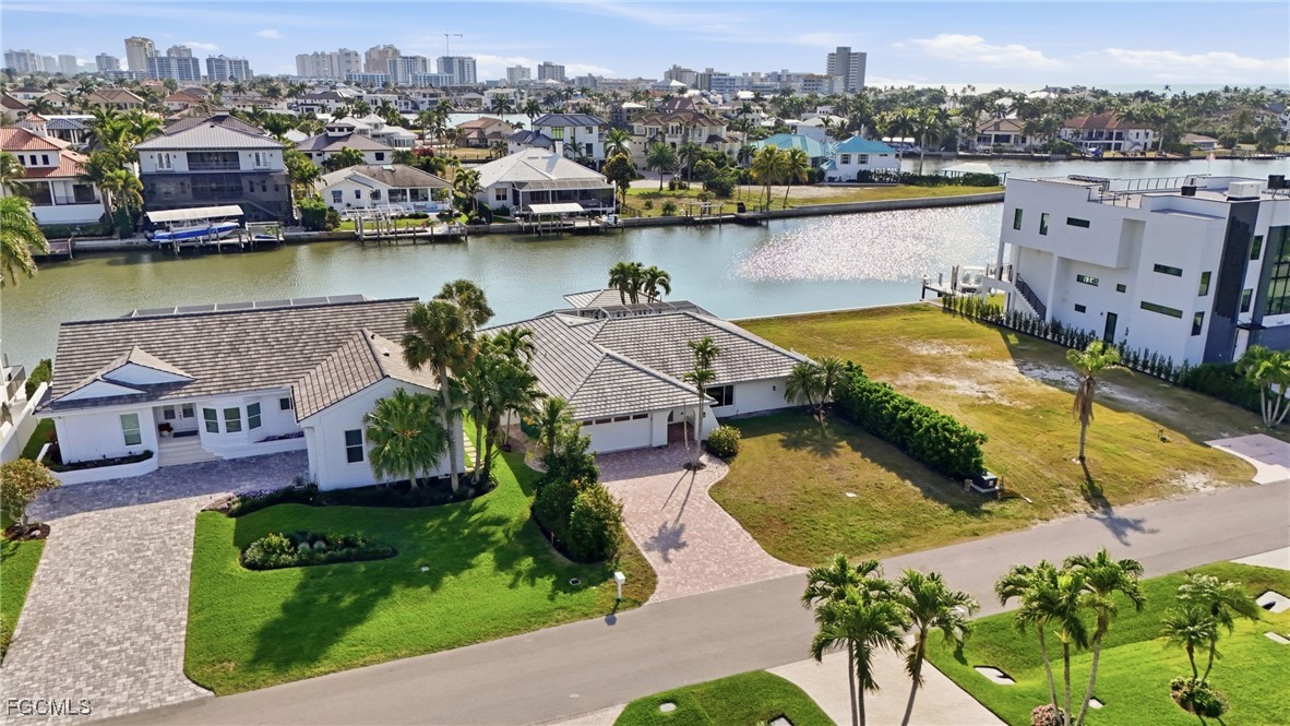 380 Conners Avenue Naples, FL 34108 - Photo 7 of 49 an aerial view of a house with a lake view