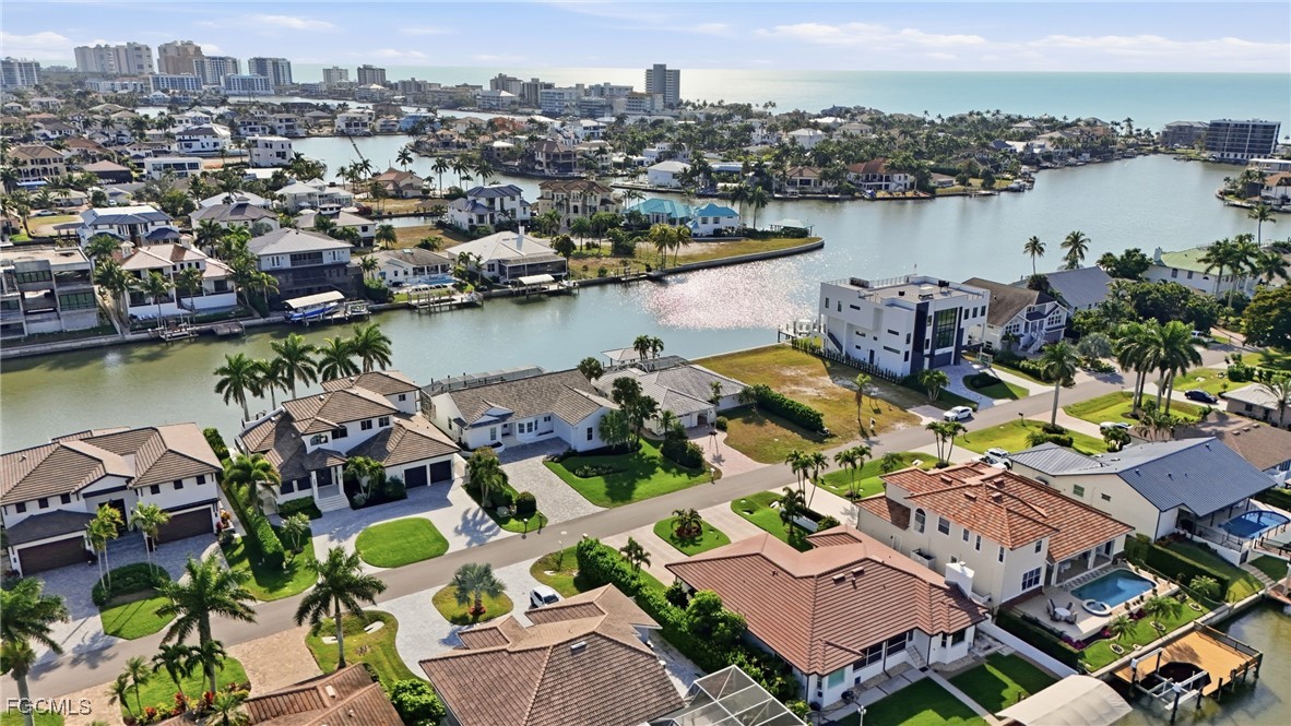 380 Conners Avenue Naples, FL 34108 - Photo 9 of 49 an aerial view of a house with a lake view