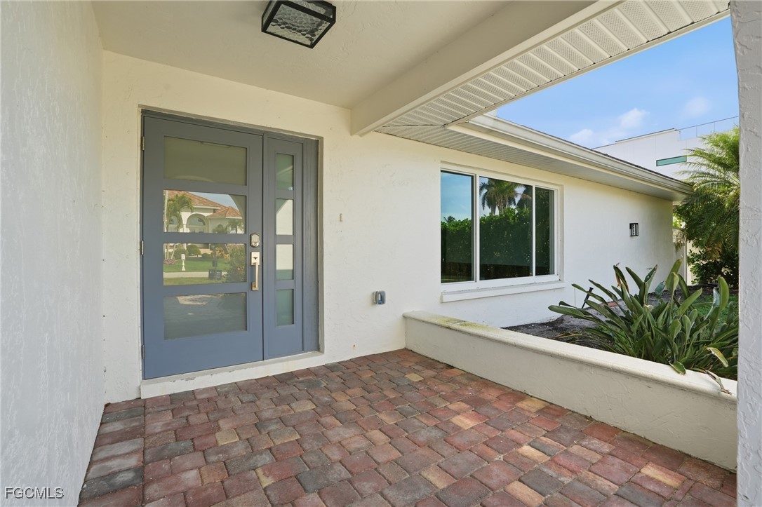 380 Conners Avenue Naples, FL 34108 - Photo 10 of 49 a view of a entryway