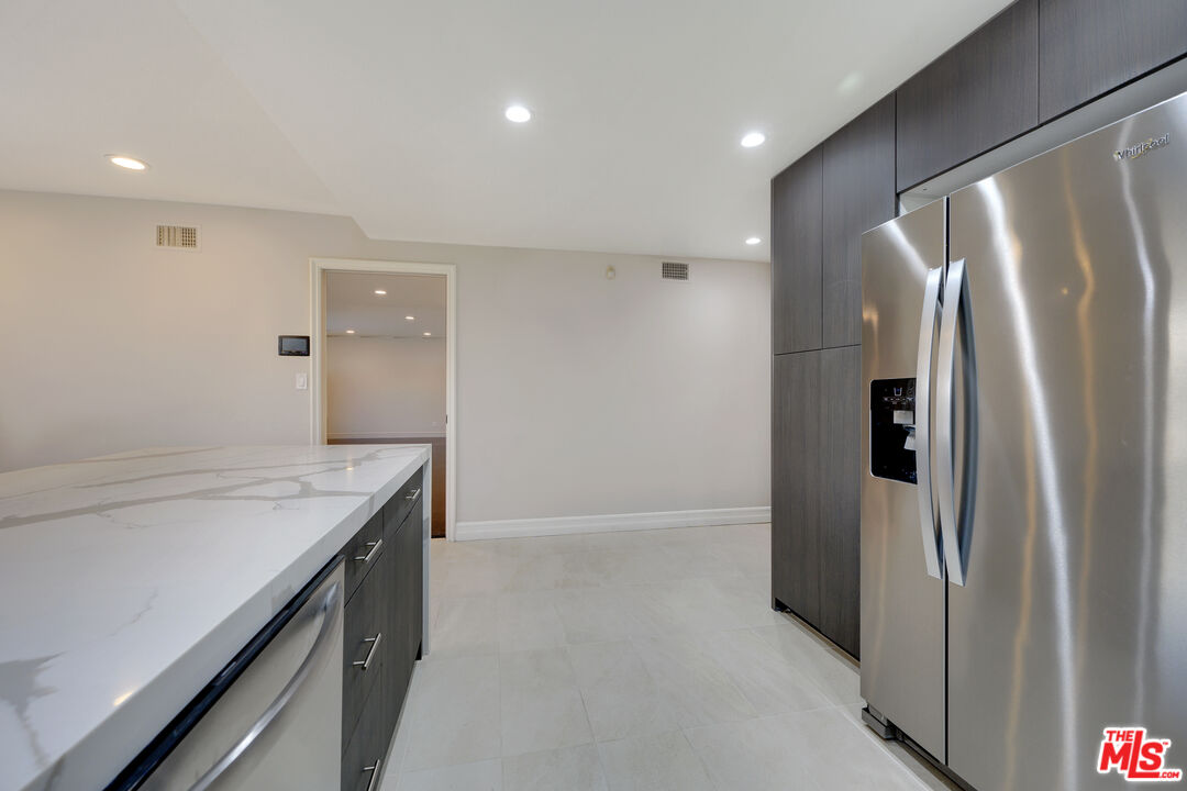 2169 Hercules Drive Los Angeles, CA 90046 - Photo 12 of 29 a kitchen with a refrigerator and countertop