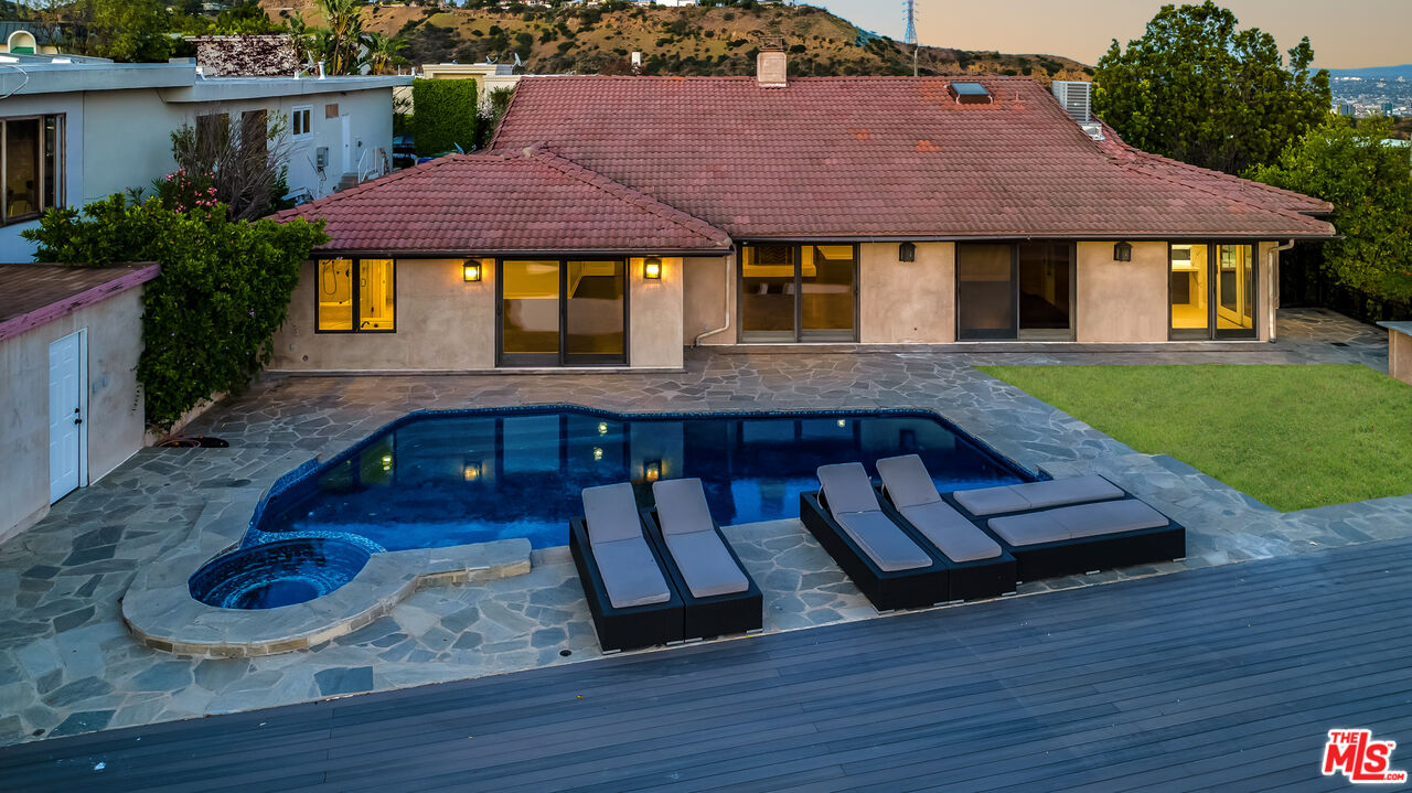 2169 Hercules Drive Los Angeles, CA 90046 - Photo 20 of 29 a view of a yard with a table and chair