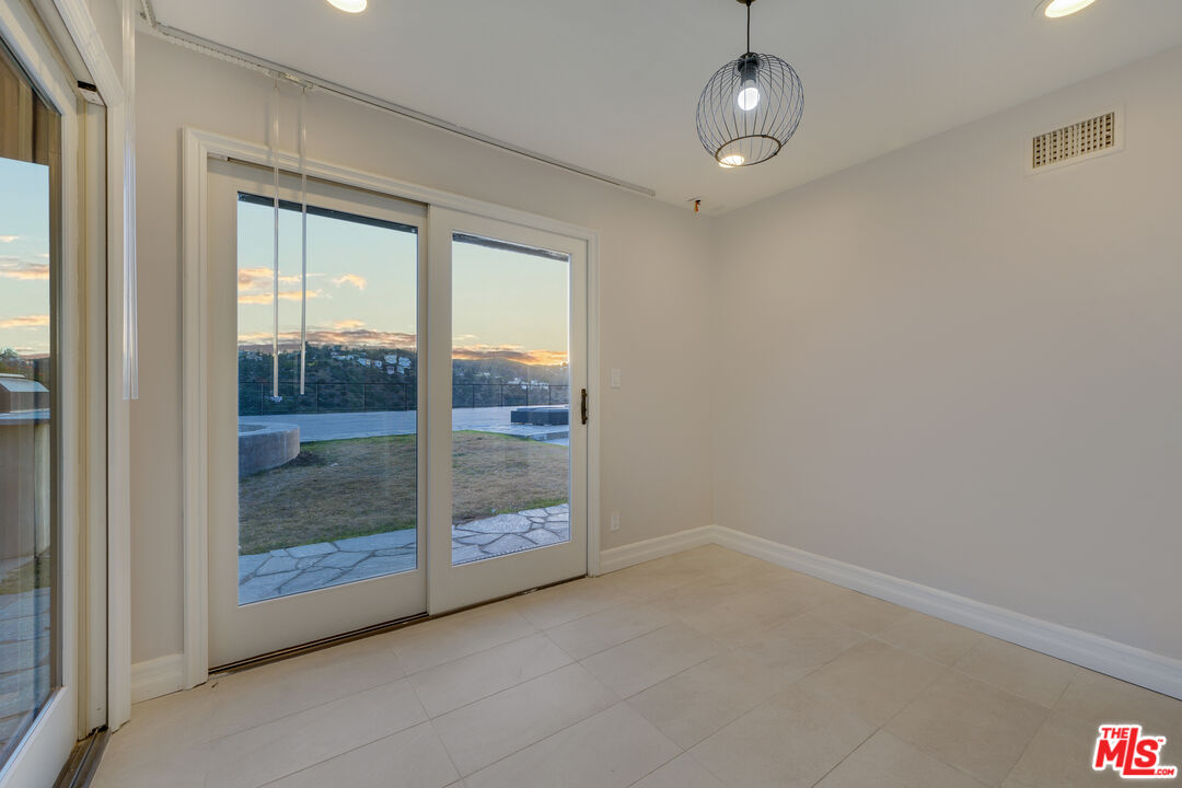 2169 Hercules Drive Los Angeles, CA 90046 - Photo 26 of 29 a view of an empty room with glass door