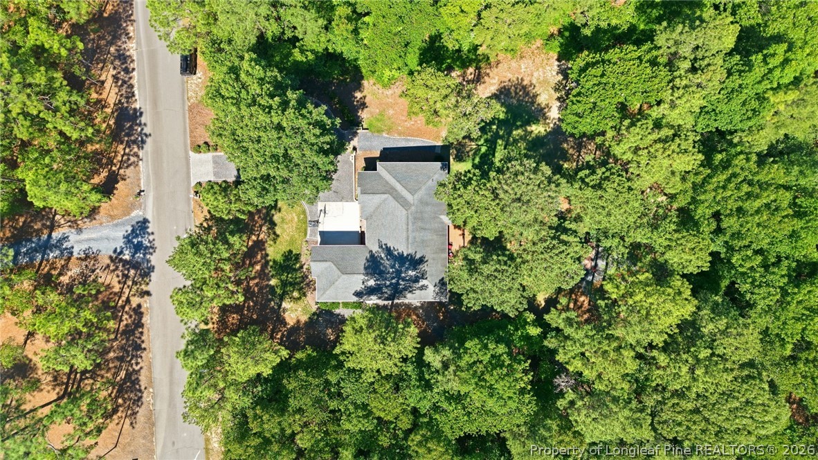 16 Ridge Road Jackson Springs, NC 27281 - Photo 47 of 50 an aerial view of a house with a yard and large trees