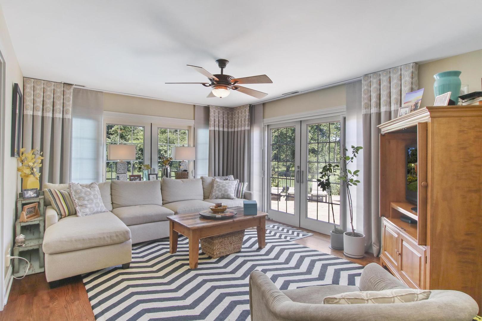 720 Becker Road Glenview, IL 60025 - Photo 13 of 44 a living room with furniture and a large window