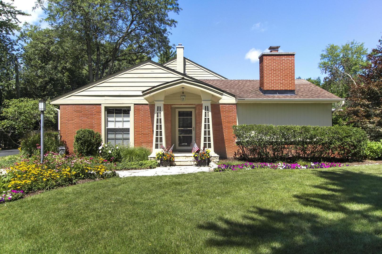 720 Becker Road Glenview, IL 60025 - Photo 2 of 44 a front view of a house with a yard and porch