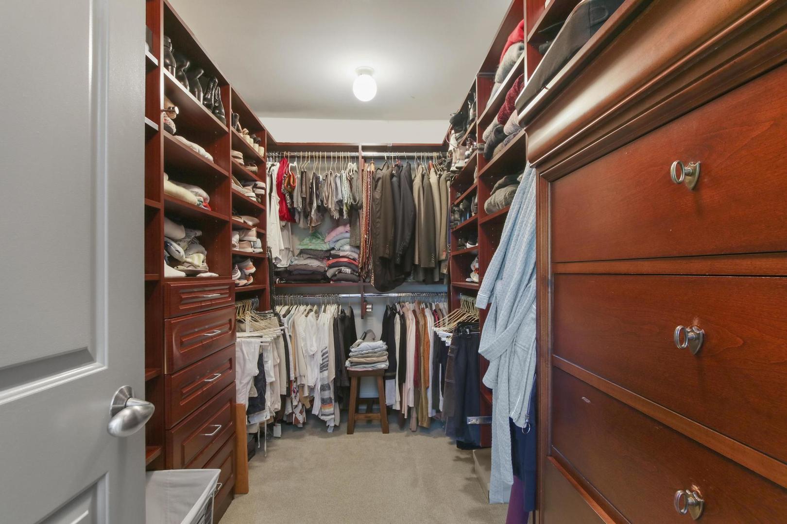 720 Becker Road Glenview, IL 60025 - Photo 21 of 44 a view of walk in closet with clothes