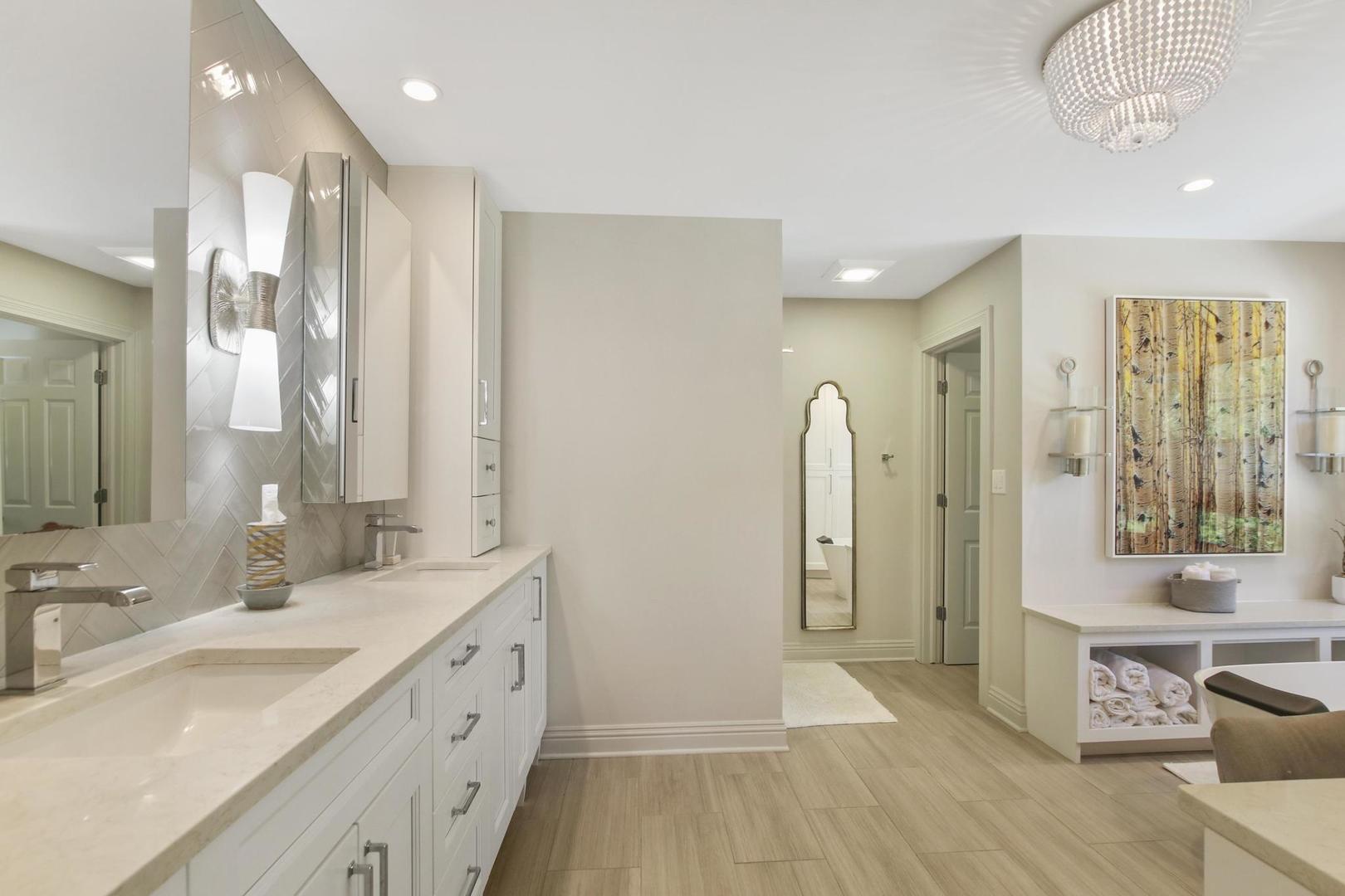 720 Becker Road Glenview, IL 60025 - Photo 22 of 44 a spacious bathroom with a double vanity sink a mirror and a shower