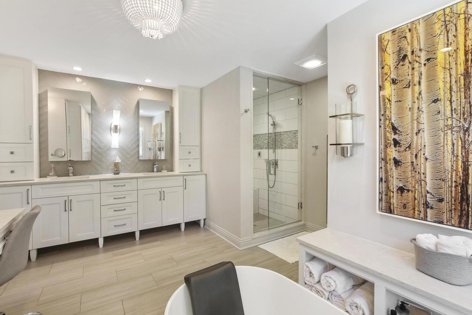 720 Becker Road Glenview, IL 60025 - Photo 24 of 44 a spacious bathroom with double vanity sink a shower and a mirror