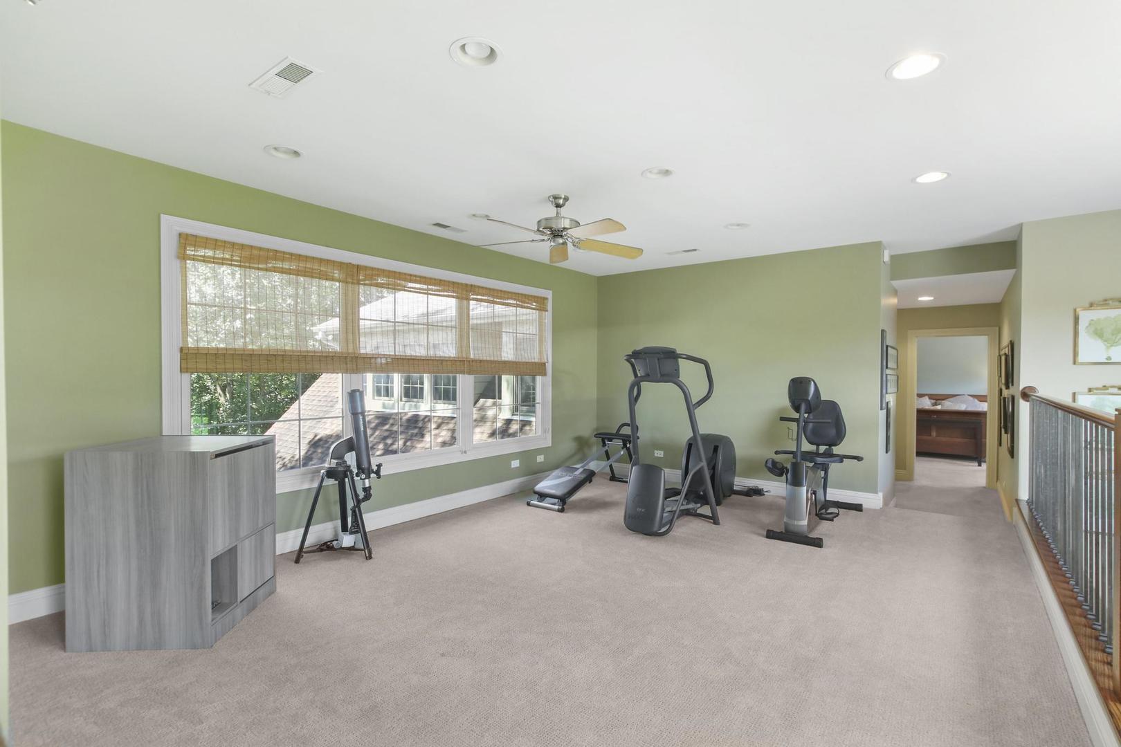 720 Becker Road Glenview, IL 60025 - Photo 25 of 44 a living room with furniture and large windows