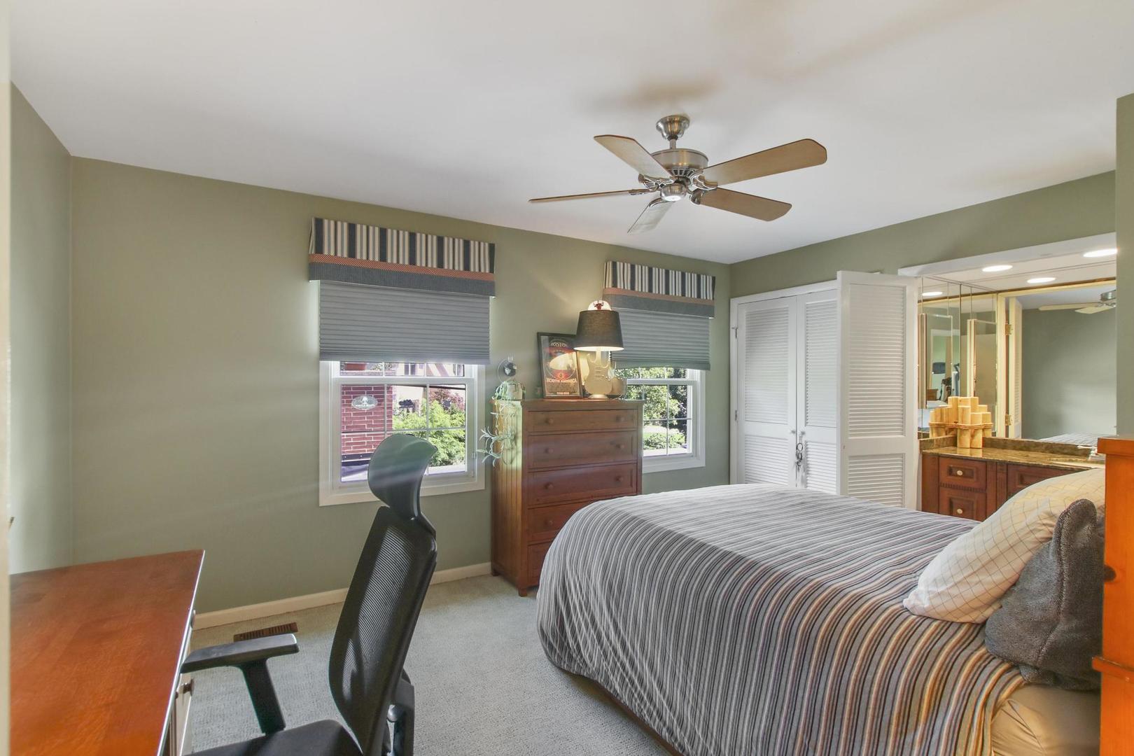 720 Becker Road Glenview, IL 60025 - Photo 28 of 44 a bedroom with a bed dresser and a dining table