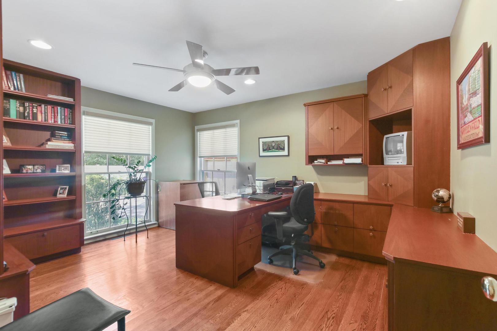 720 Becker Road Glenview, IL 60025 - Photo 30 of 44 a living room with fireplace furniture and a wooden floor