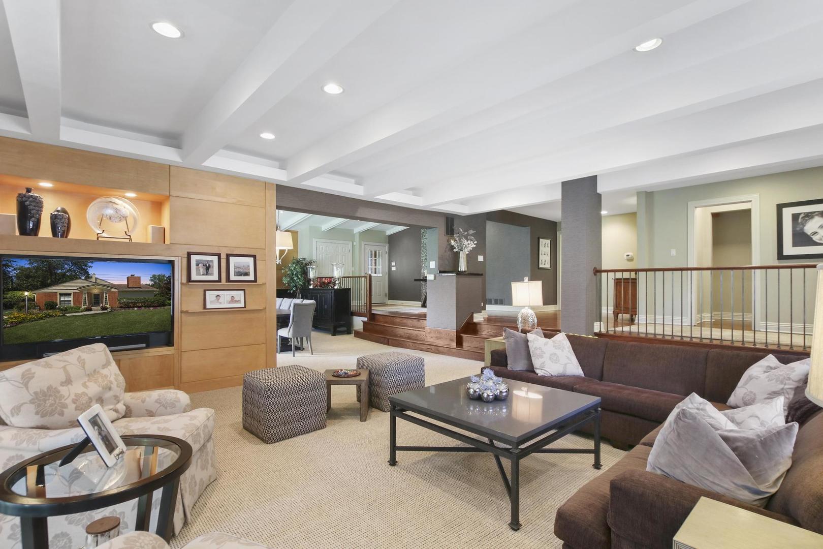 720 Becker Road Glenview, IL 60025 - Photo 7 of 44 a living room with furniture and a floor to ceiling window