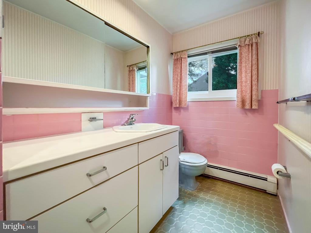 37 Full Turn Road Levittown, PA 19056 - Photo 21 of 38 a bathroom with a sink a toilet and a mirror