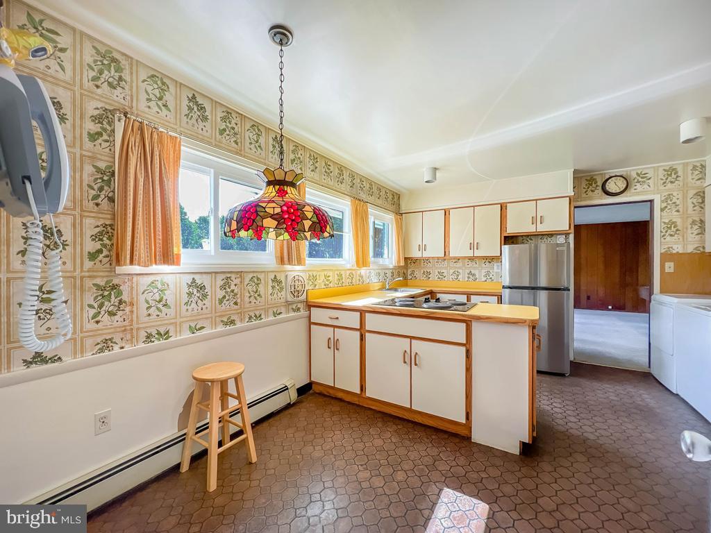 37 Full Turn Road Levittown, PA 19056 - Photo 8 of 38 a kitchen with granite countertop a sink cabinets stainless steel appliances and a window