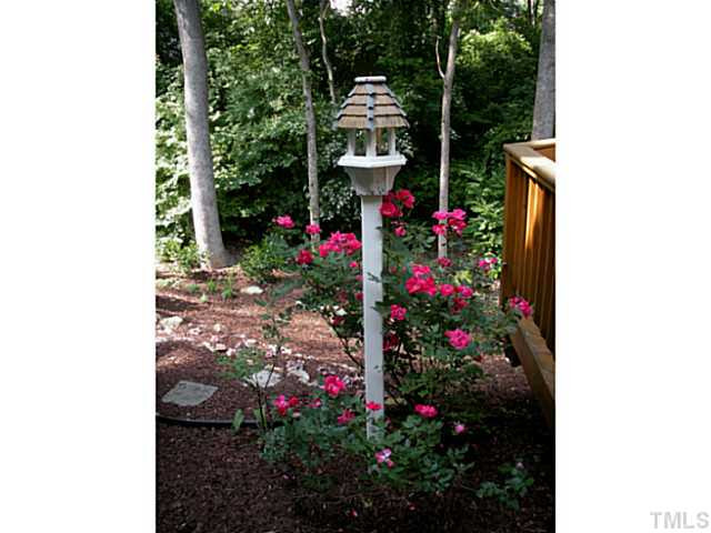 Peaceful and restful setting backing to trees. Low maintenance living. Large deck for entertaining. Exterior Back