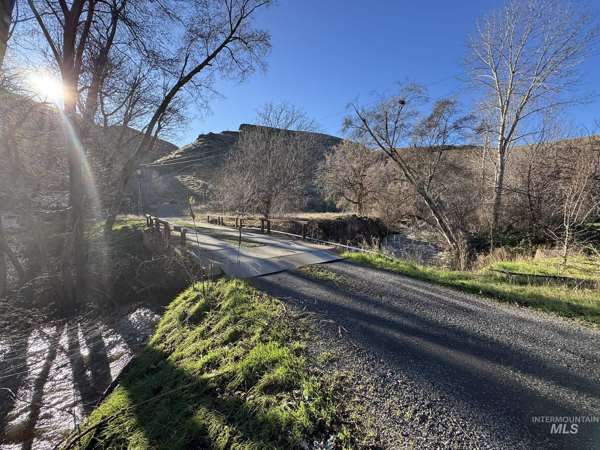 View of dirt / gravel road featuring a mountain view