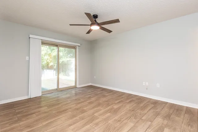 a view of a kitchen with a sink and a stove top oven