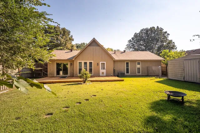 a front view of house with swimming pool and porch with furniture