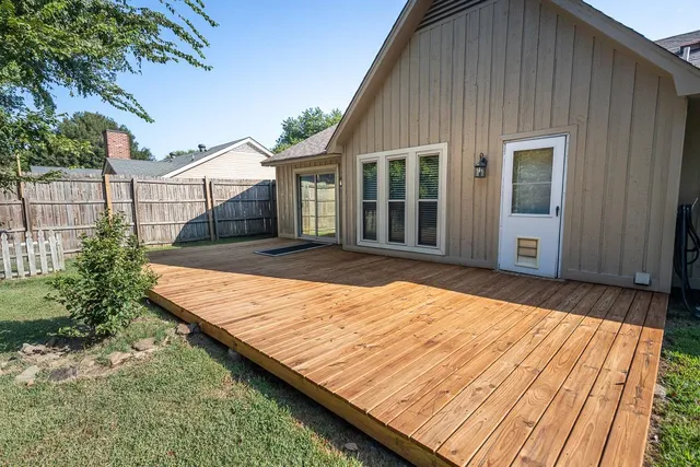 a view of a house with swimming pool and a yard