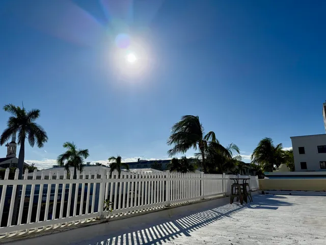 a view of empty room with closet and wooden floor