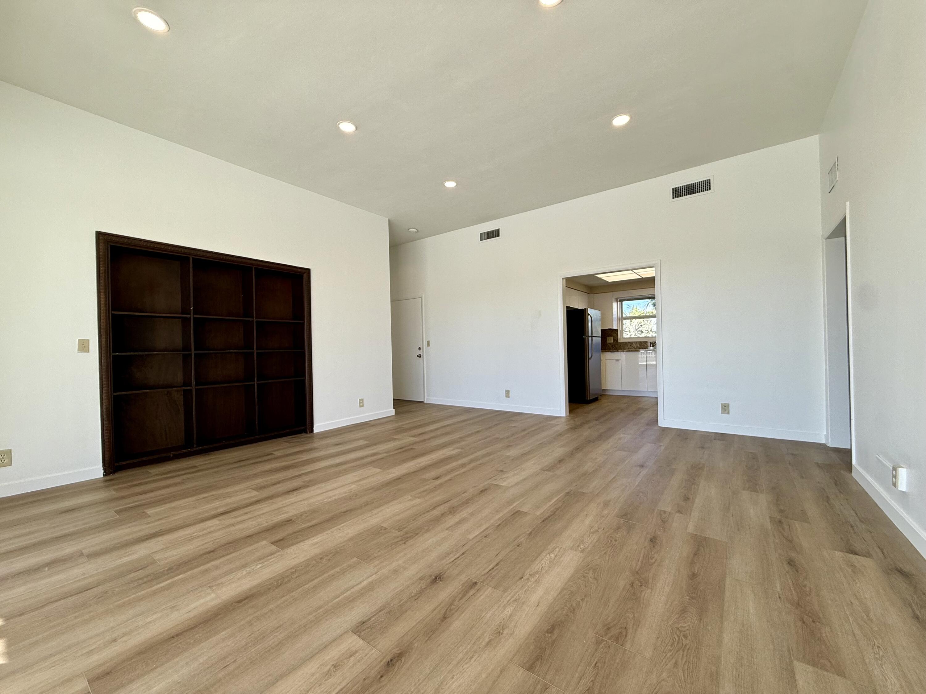 1165 East Atlantic Avenue, Unit A Delray Beach, FL 33483 - Photo 24 of 30 a view of an empty room with closet and entryway