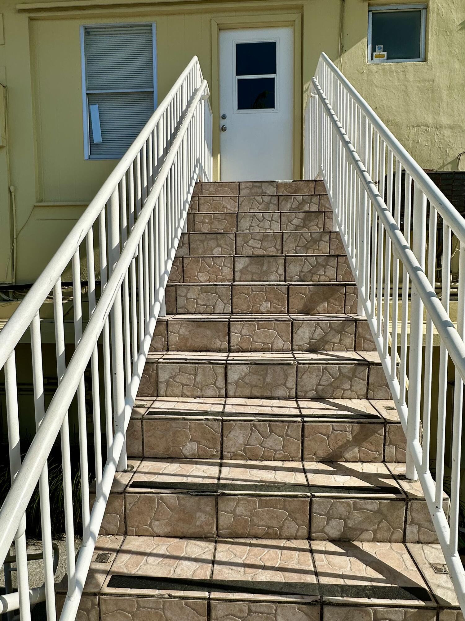 1165 East Atlantic Avenue, Unit A Delray Beach, FL 33483 - Photo 27 of 30 a view of entryway with wooden floor