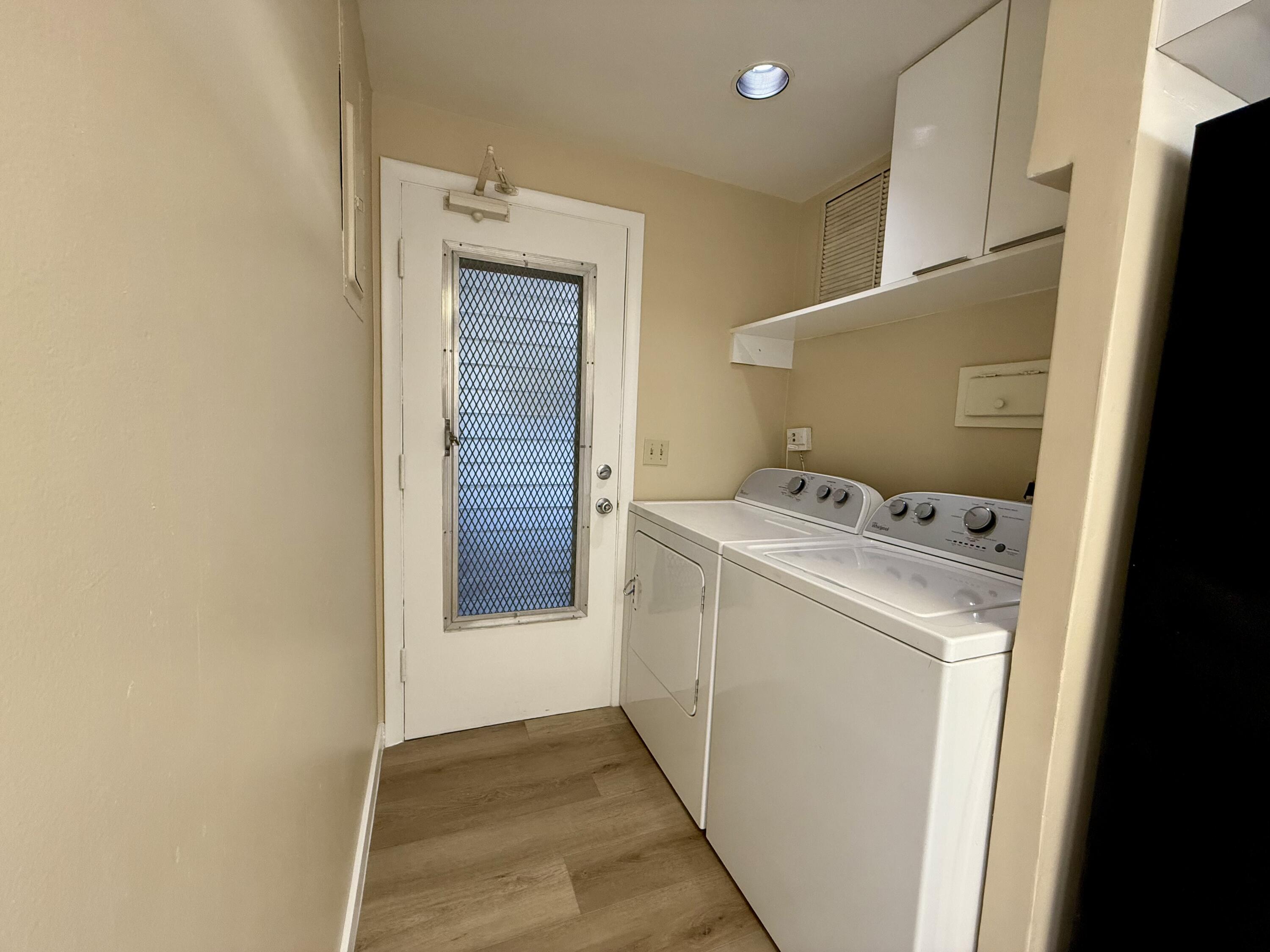 1165 East Atlantic Avenue, Unit A Delray Beach, FL 33483 - Photo 7 of 30 a utility room with dryer and washer