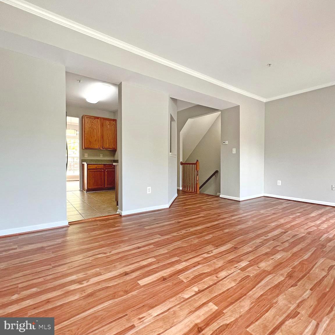 2718 Zeek Lane Lanham, MD 20706 - Photo 13 of 32 a view of empty room with wooden floor and fan