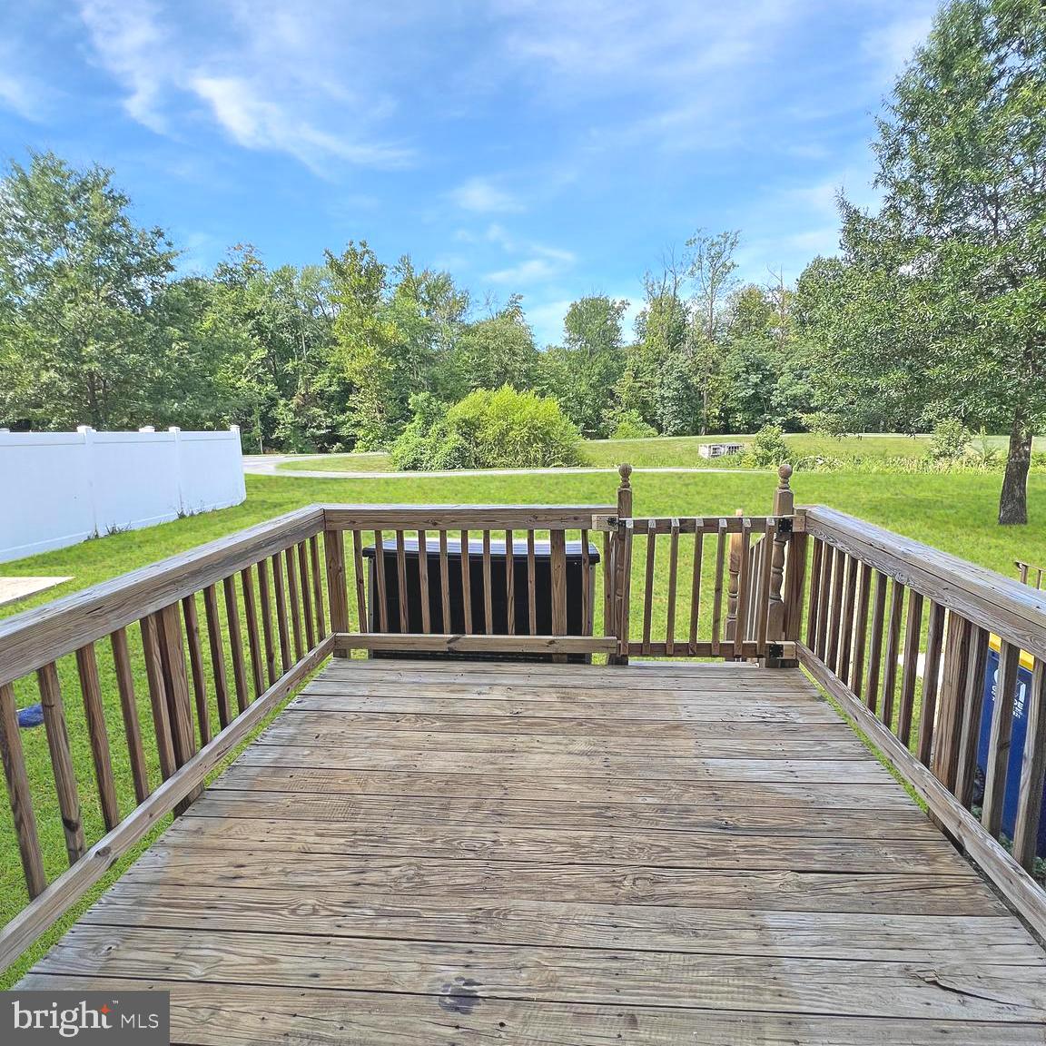 2718 Zeek Lane Lanham, MD 20706 - Photo 29 of 32 a view of a deck with a yard and wooden fence