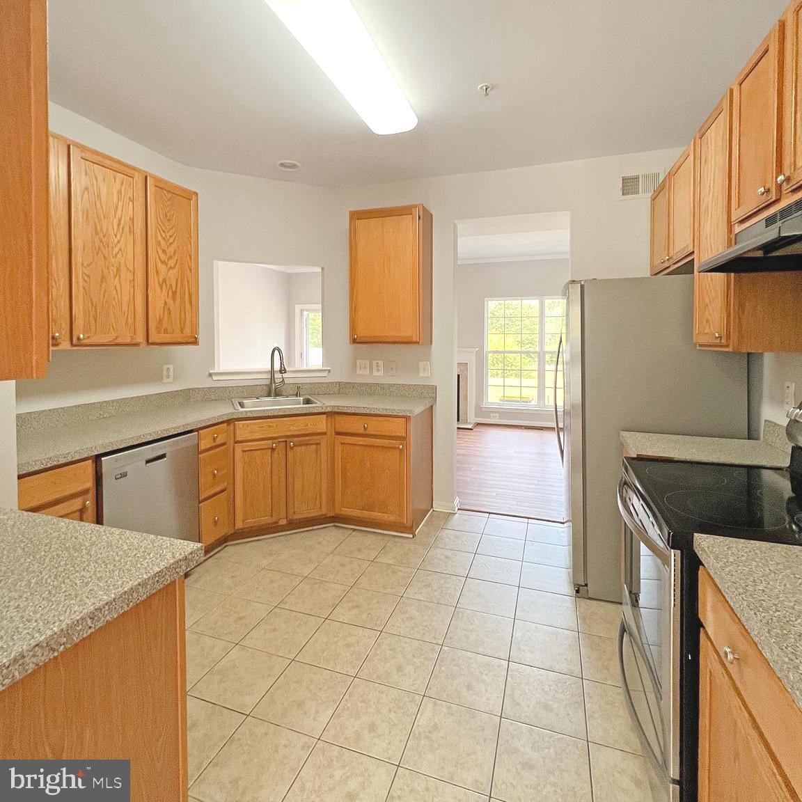 2718 Zeek Lane Lanham, MD 20706 - Photo 5 of 32 a kitchen with a sink a stove and cabinets