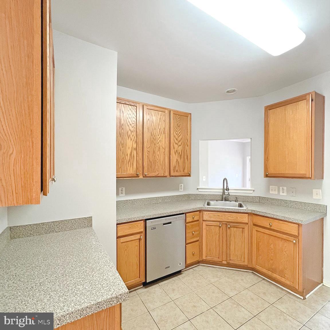 2718 Zeek Lane Lanham, MD 20706 - Photo 7 of 32 a kitchen with a sink window and cabinets
