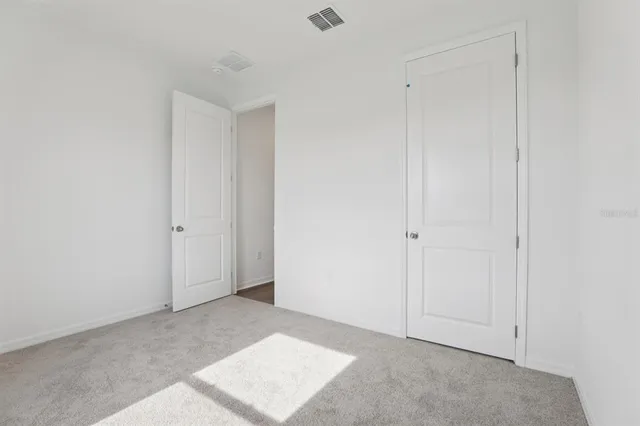 a bathroom with a double vanity sink toilet mirror and bathtub