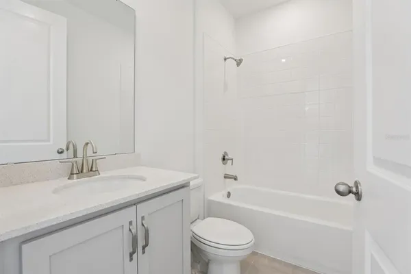 a bathroom with a sink a toilet and a bathtub