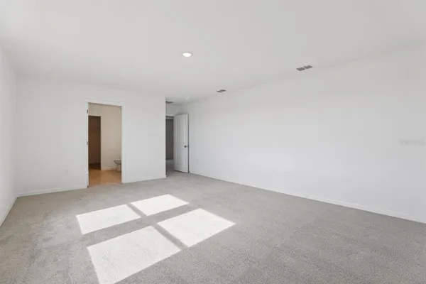 a bathroom with a double vanity sink and a toilet