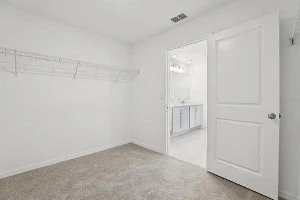 a view of a room with racks on the wall