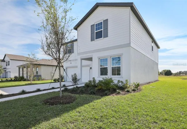 a house view with swimming pool
