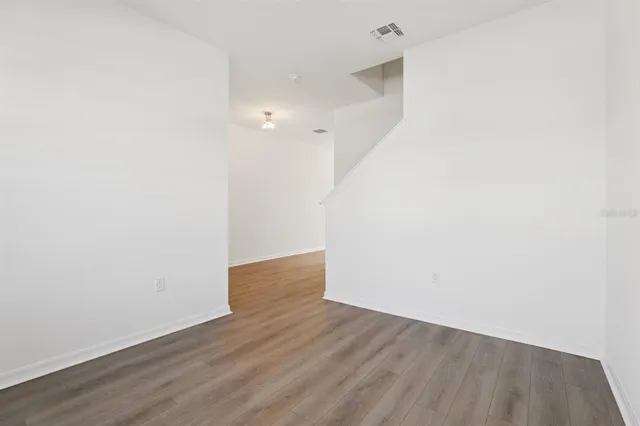 a view of kitchen with wooden floor and window