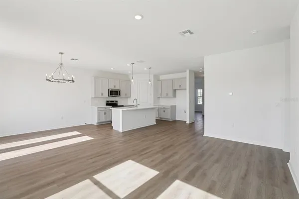 a view of kitchen with wooden floor and window
