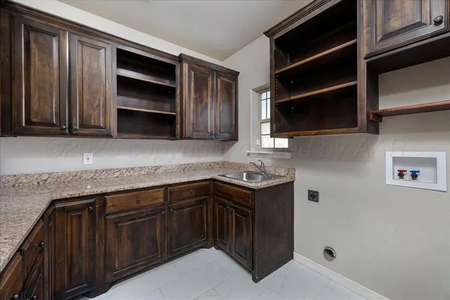 a view of empty room with a fireplace