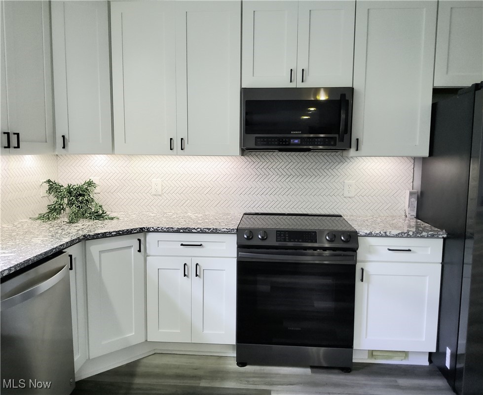 9415 Stone Road Litchfield, OH 44253 - Photo 9 of 28 Custom built cabinets, undermount lighting.