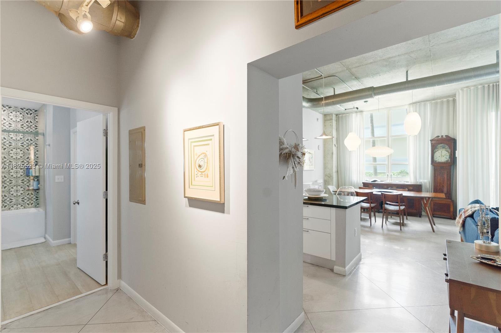 2001 Biscayne Boulevard, Unit 2201 Miami, FL 33137 - Photo 18 of 42 a dining room with furniture and a large window