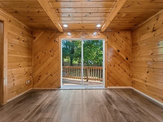 a view of a room with wooden walls