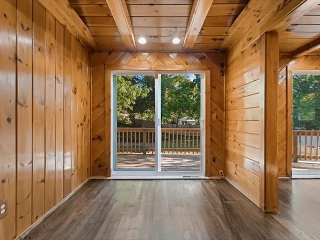 a view of front door with wooden floor