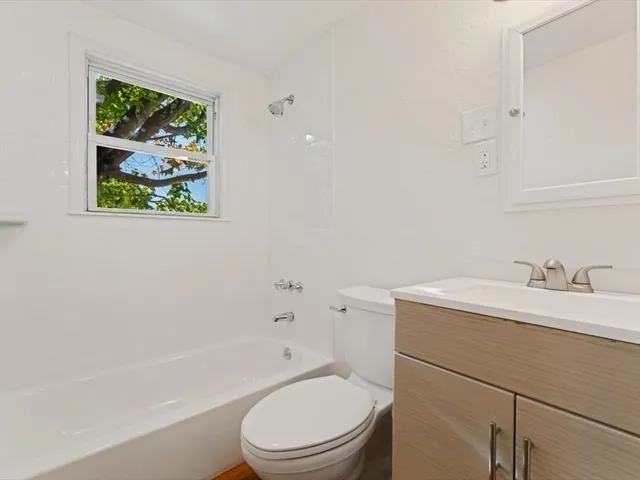 a bathroom with a toilet a sink and a bathtub