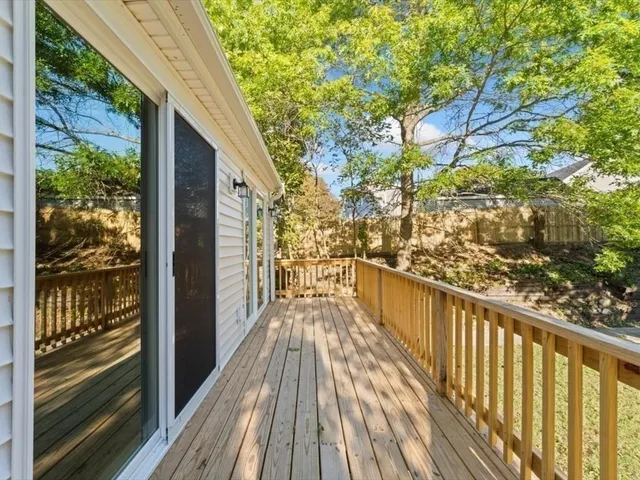 a view of balcony with wooden floor