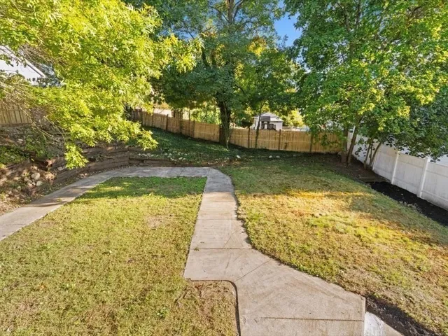a view of yard with swimming pool